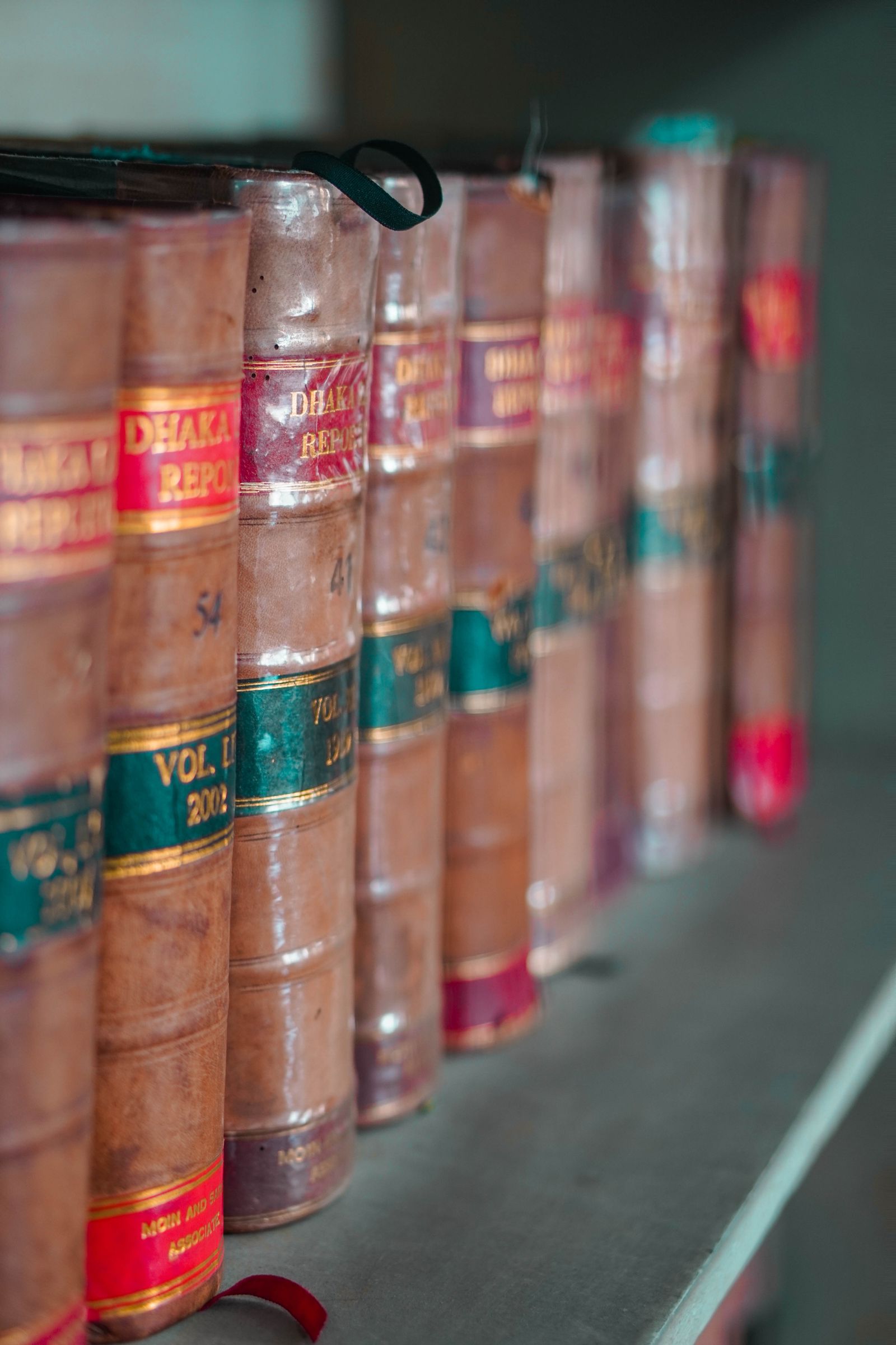 Leather-bound case reporters lined up on a law library shelf